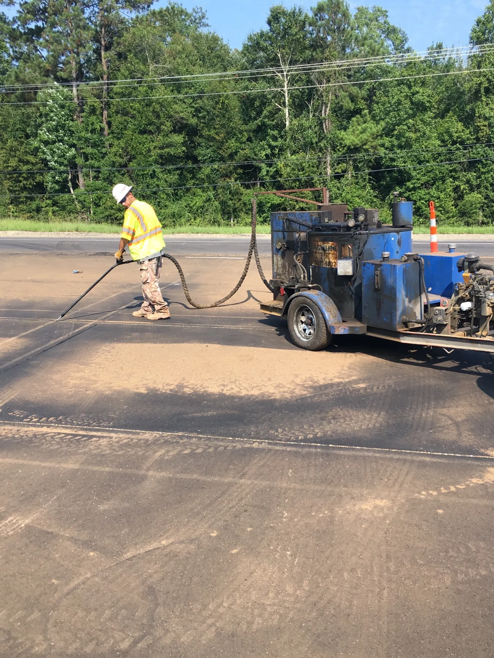 Hot pour joint sealing of pavement by TNT Construction Group